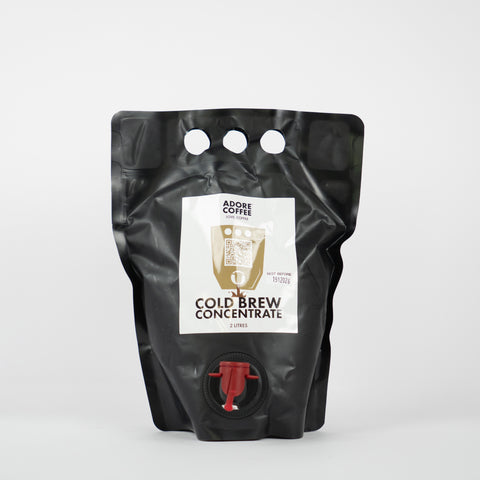 Black packaging of cold brew concentrate with a label on a white background